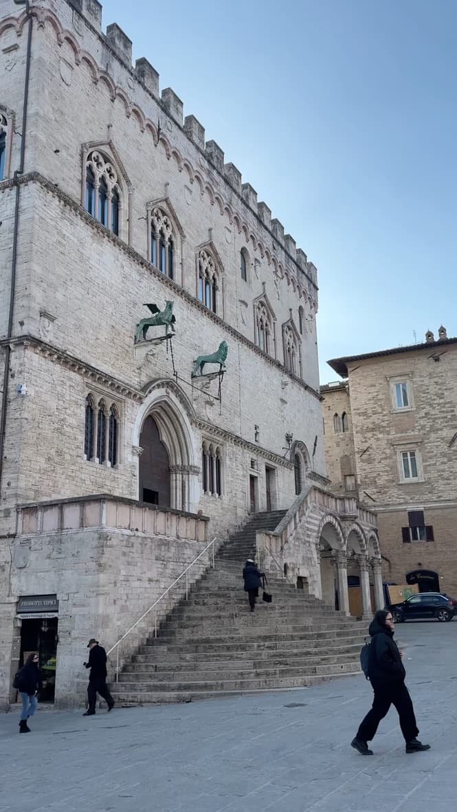 People walking through an Italian piazza
