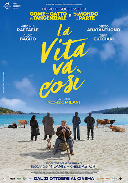 Poster for La vita va così, showing Efisio seated on a Sardinian beach between local residents and grazing cattle.