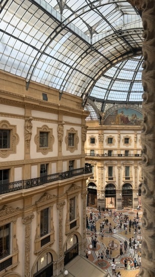 People beneath the glass roof of Galleria Vittorio Emanuele II in Milan.