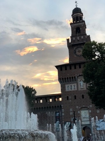 The fountain and Castello Sforzesco at sunset in Milan.