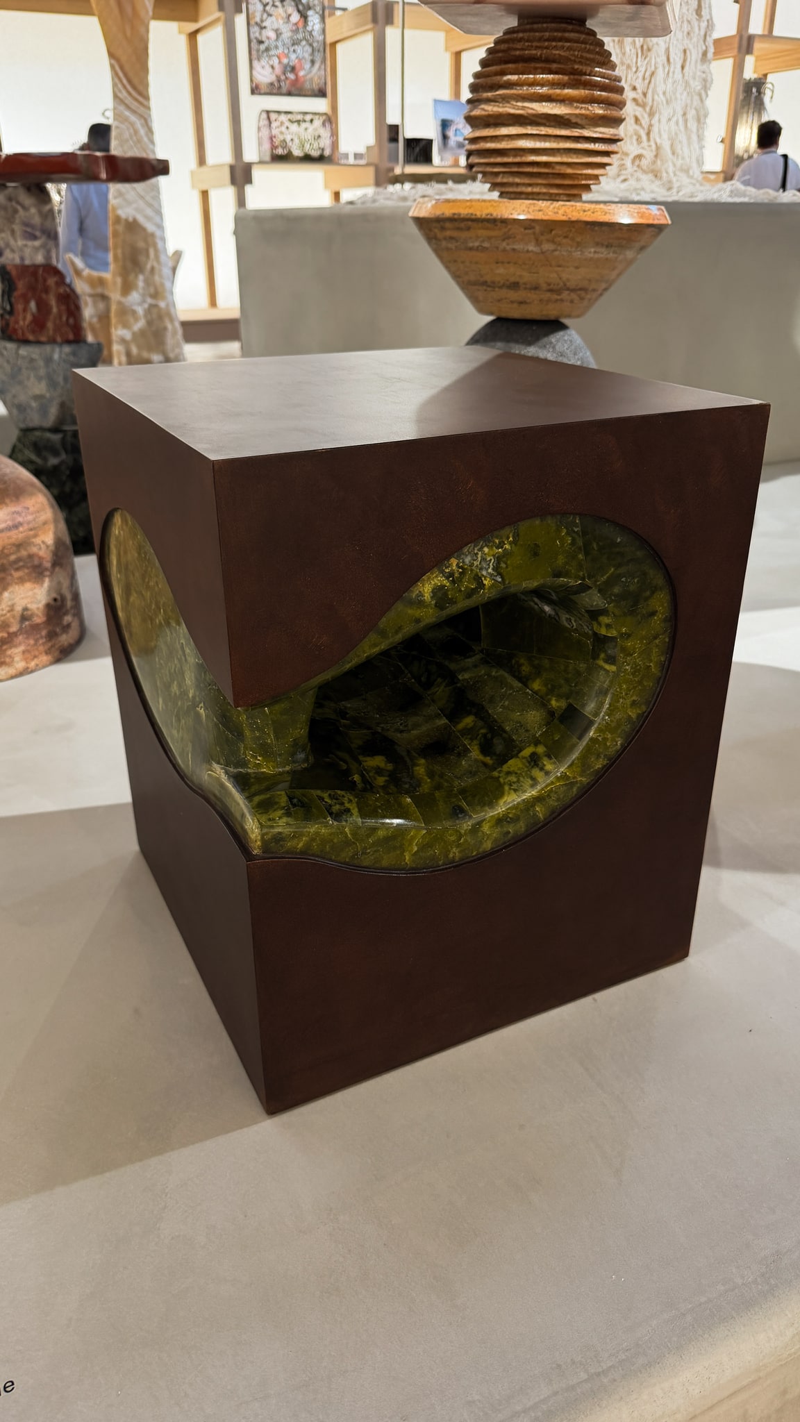 A green interior revealed within a geometric form.