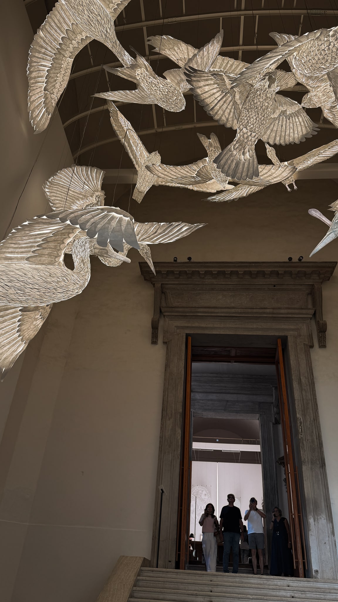 Birds of light above the staircase.