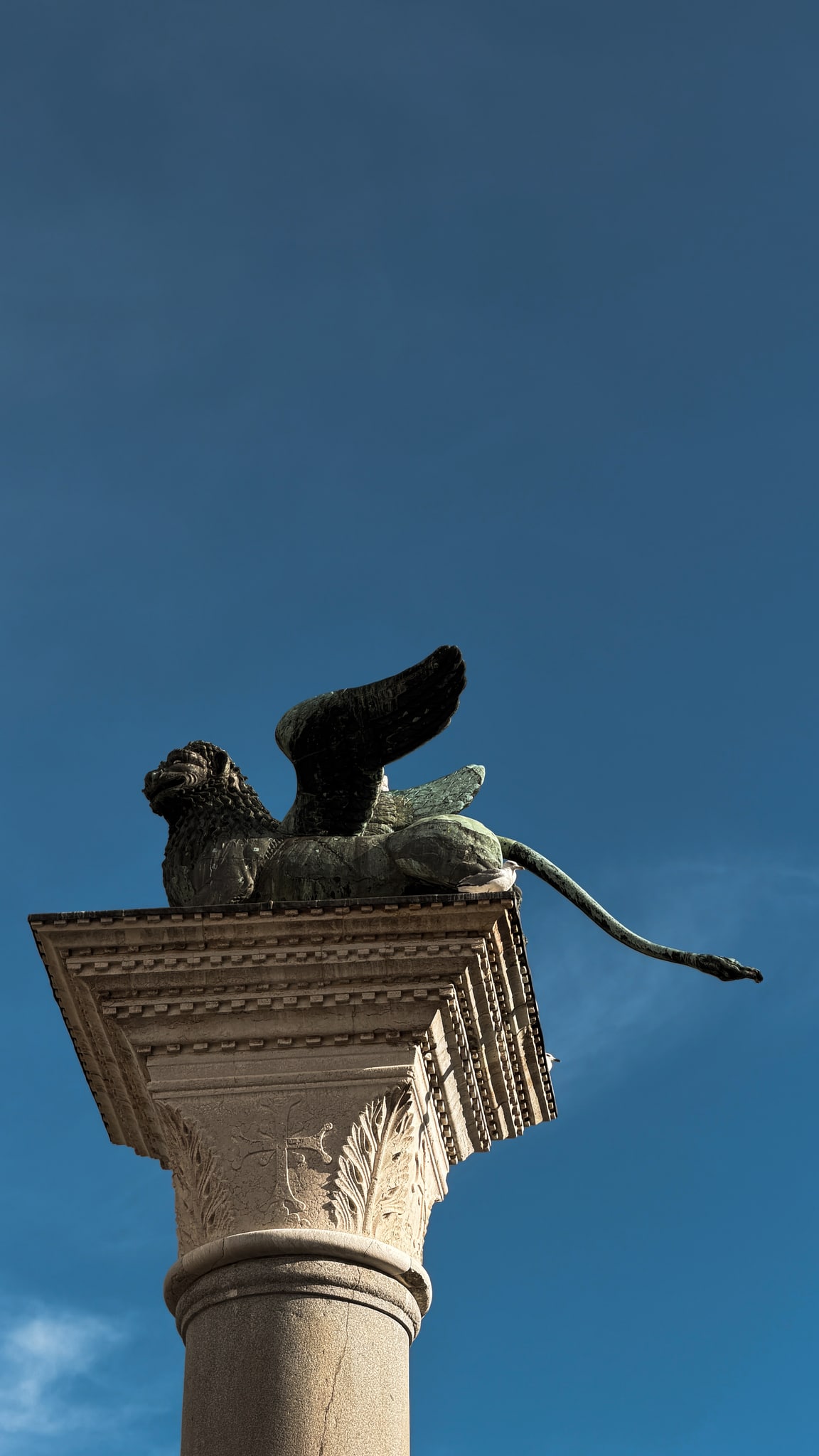 The winged lion against the Venetian sky.