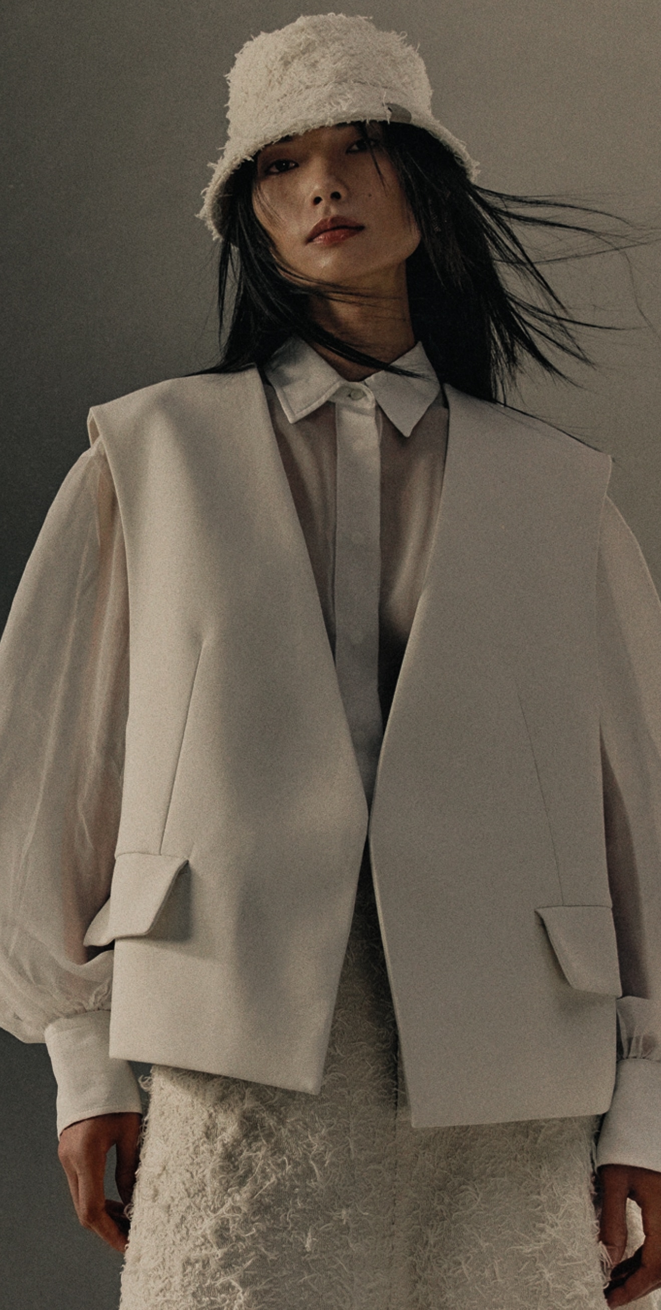 Cream tailoring with a textured hat and pale shirt.